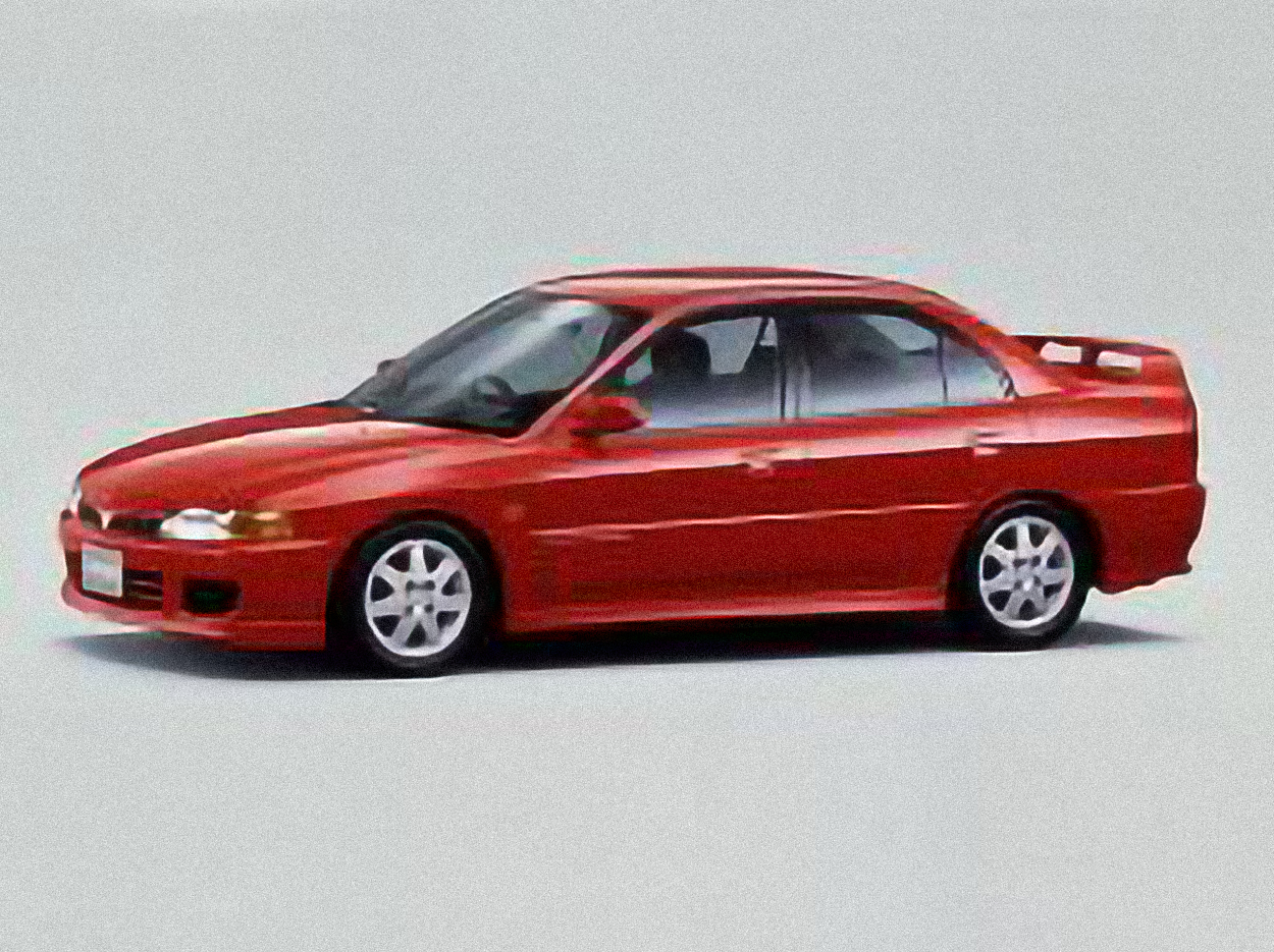 Mitsubishi Lancer Evolution VI – årsmodell 1997 i bild Bild på Mitsubishi Lancer Evolution VI – årsmodell 1997