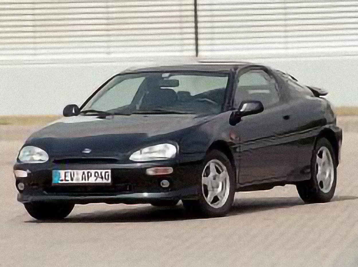 Mazda MX-3 – årsmodell 1994 i bild Bild på Mazda MX-3 – årsmodell 1994