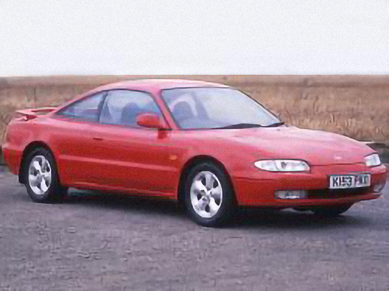 Mazda MX-6 2.0i – årsmodell 1992 i bild Bild på Mazda MX-6 2.0i – årsmodell 1992