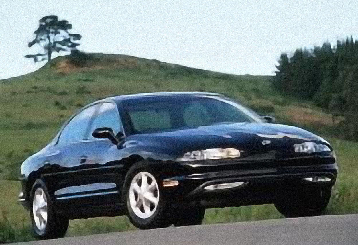 Oldsmobile Aurora Pace Car – årsmodell 1997 i bild Bild på Oldsmobile Aurora Pace Car – årsmodell 1997